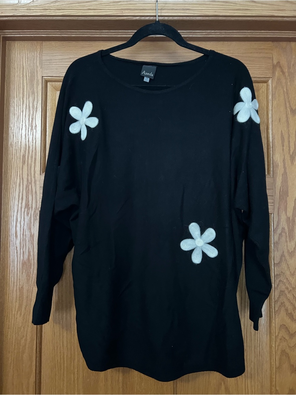 Aaeda Black Crewneck Sweater with White Floral Appliqués